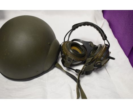 A collection of Militaria including Gas Mask, Head Phones and Combat Vehicle Crewman Helmet etc
Condition Report Mid 20th Cen