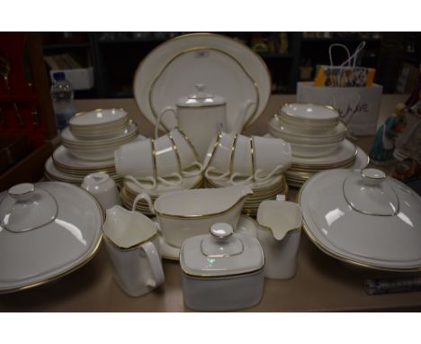 A Royal Doulton part tea service 'Gold concord', includes coffee pot,tureens, bowls, plates, cups and saucers, serving platte