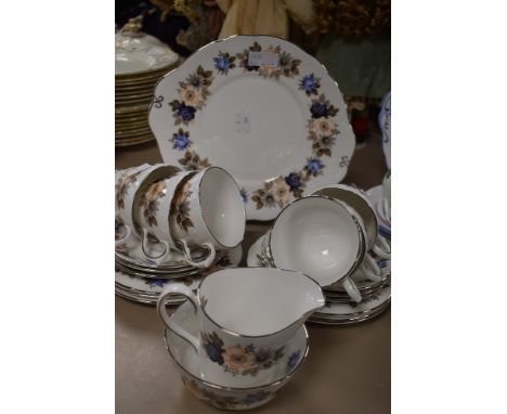 A mid century Royal Sutherland part tea service having silver gilt accents and floral transfer pattern in Blue muted pastel t