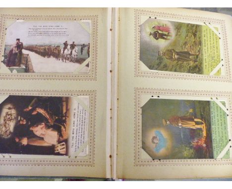 A vintage album of approximately 120 postcards and photographs