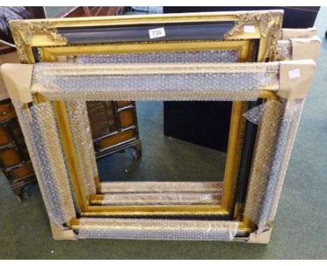 Four large gilt and black painted vintage style picture frames. interior 60 x 50 cm