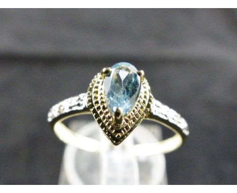 9ct gold diamond and topaz ring. Size O.