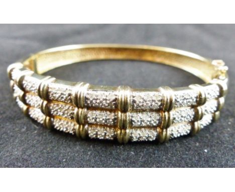 9ct gold 1.5ct pave set diamond bangle. Weight 20.5g