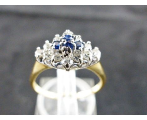 18 ct gold sapphire and diamond cluster ring. Approx 0.40 ct diamonds. Size N