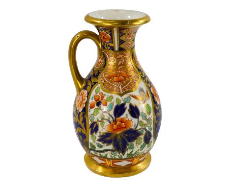 A Royal Worcester Imari decorated jug - the floral panels incorporating birds, height 16cm.