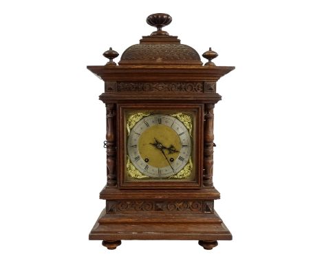 A German 19th/20th century oak cased bracket clock - with fish scale caddy top, foliate carved panels and turned pilasters, t