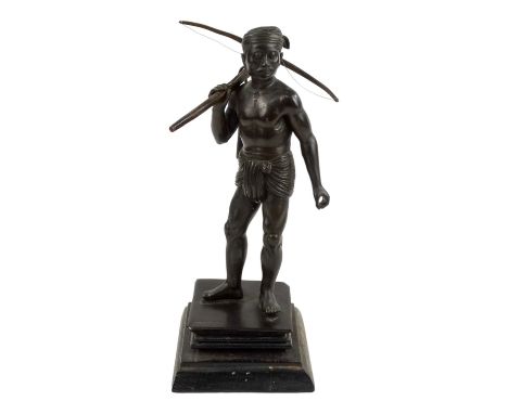 McTha Din 20th century Burmese Pegu bronze figure - standing holding a crossbow, signed to base, on a stepped wooden base, he