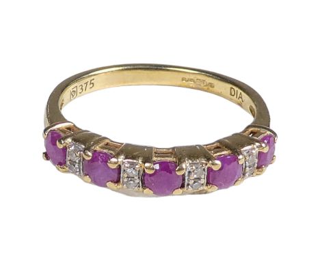 A 9ct gold diamond and ruby set ring - with a line claw setting, size K, weight 1.9g.
