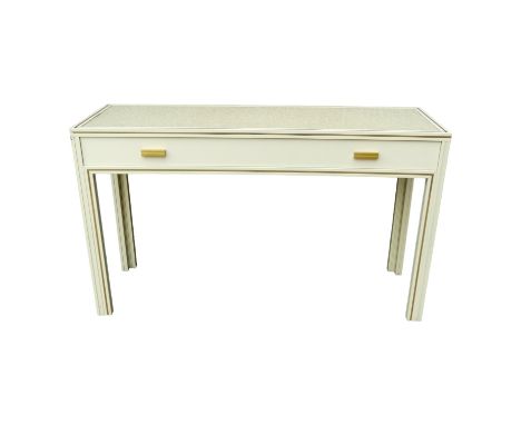 A Pierre Vandel, Paris cream console table - the rectangular top with gilt lining above a frieze drawer on square legs, width