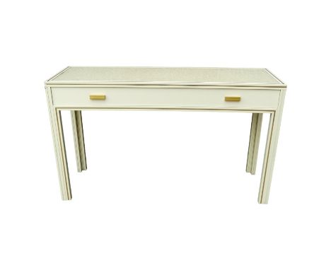 A Pierre Vandel, Paris cream console table - the rectangular top with gilt lining above a frieze drawer on square legs, width