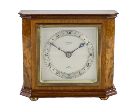 An Elliott mantel clock - silvered dial and chapter ring within a walnut case, height 14cm.