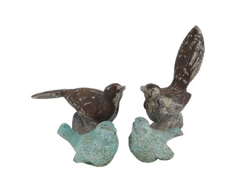 A cast lead figure of a bird - with another similar, a pair, together with a pair of cast bronze wrens, (4)