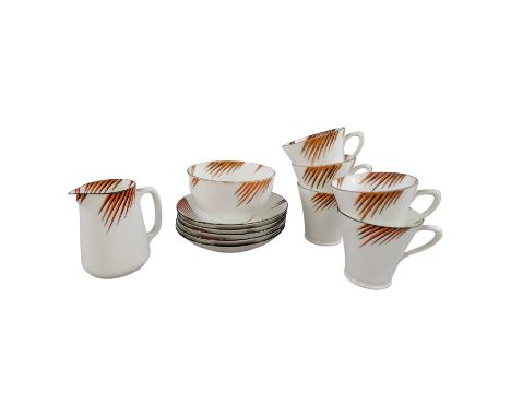 An Art Deco style tea service by Collingwood - comprising five cups and saucers, a milk jug and a sugar bowl.