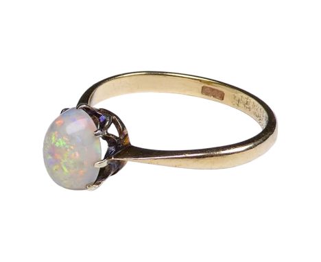 A 9ct opal ring - cabochon stone claw set on a gold band, size M, weight 1.6g.