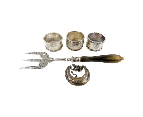 A silver serving fork - Sheffield 1893, John Sanderson, with a foliate engraved blade, together with three various napkin rin