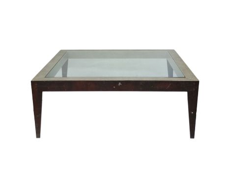 A contemporary glass and faux shagreen coffee table - square and raised on tapering profile bronze legs, 120cm x 120cm x 45cm