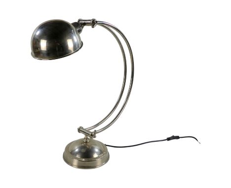 A 20th century chrome table lamp - with a C-shaped support and domed shade, height 55cm.