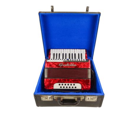 A vintage piano accordion by Galotta - 12 bass, with a red pearl case, boxed.