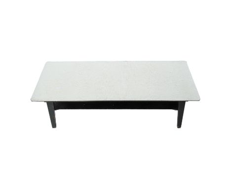 A vintage Formica coffee table - the grey top above a black painted frame and undertier, 102 x 38 x 32cm.