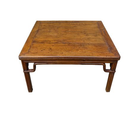 A late 19th century Chinese oriental hardwood low table - the square panelled top above cluster column legs, with wax export 