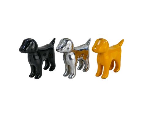 A 20th century table lighter in the form of a dog - chrome, height 6cm, together with two similar, one mustard and the other 