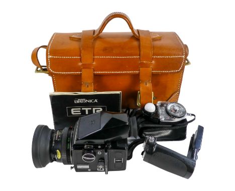 A Zenza Bronica ETRS camera - fitted with a 75mm f/2.8 lens, with a prism viewer, film back and pistol grip, also associated 