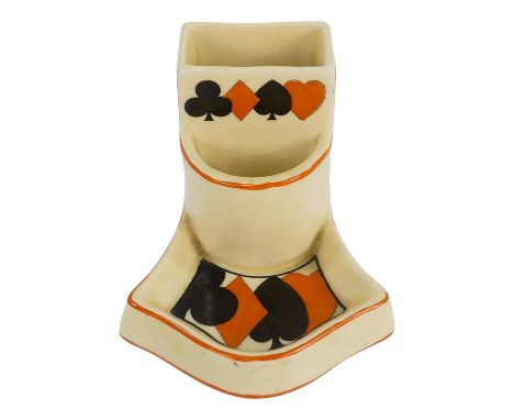 A Royal Doulton match striker - decorated with playing card symbols on a cream ground, height 7cm.