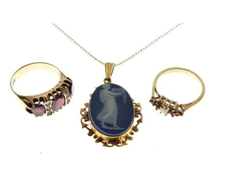 9ct gold ring set three red garnet-coloured stones, 9ct gold, opal and red stone dress ring, and a yellow metal pendant set o