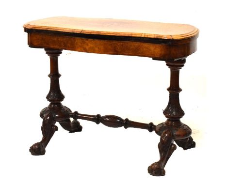 Mid Victorian inlaid figured walnut fold-over card table, the shaped hinged top enclosing baize-lined playing surface on stip