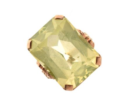 Yellow metal dress ring set large pale yellow/green emerald-cut stone, shank stamped 9ct, size P, 11.6g gross approx  