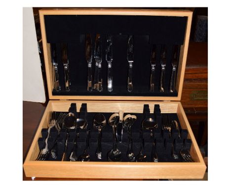 Modern light oak-cased canteen of stainless steel cutlery  