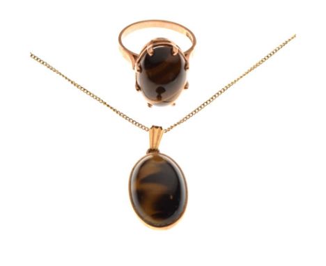 Yellow metal ring mounted with tigers-eye oval cabochon, size M, together with a similar pendant with fine chain, 9.4g gross 