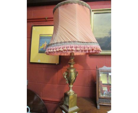 A brass urn shaped table lamp with plinth base, tasselled shade 98cm 