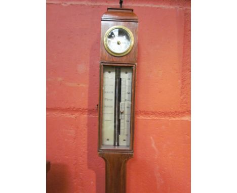 A moulded head, hygro top mahogany station marine barometer having glazed door, in an earlier style, with working mercury tub
