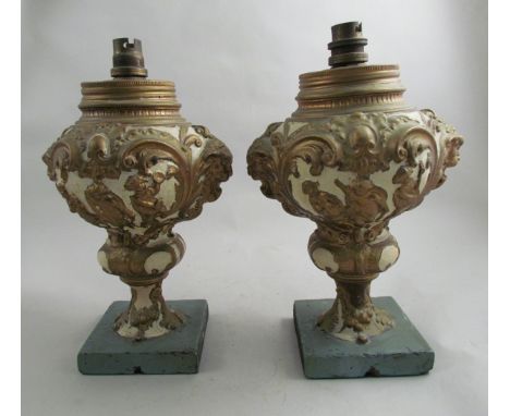 A pair of 19th Century cream and gold painted lamp bases 
