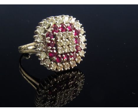 An 18ct white gold ruby and diamond cluster ring