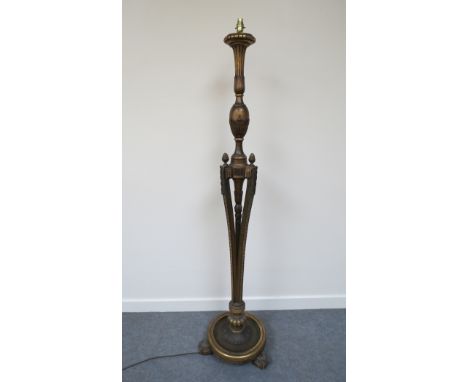 A gilt painted decorative lamp standard