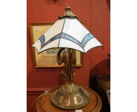An Art Nouveau style lamp base with lead glazed lamp shade, 47cm tall