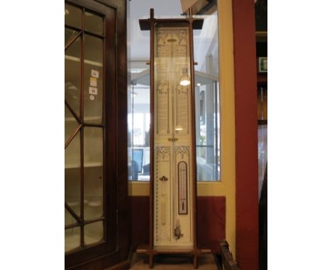 A mahogany cased Admiral Fitzroy's barometer with central mercury tube and aneroid thermometer, 107cm x 28cm