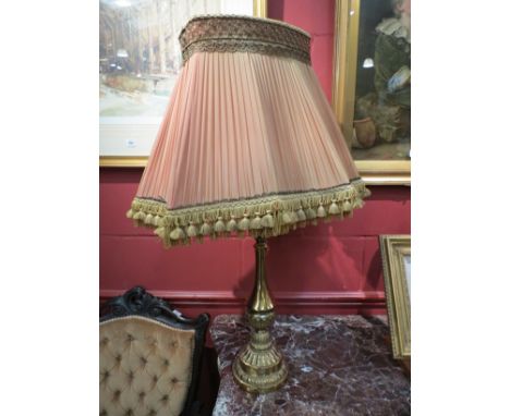 An embossed brass lamp with acanthus detail, shaped tasselled shade 88cm tall 