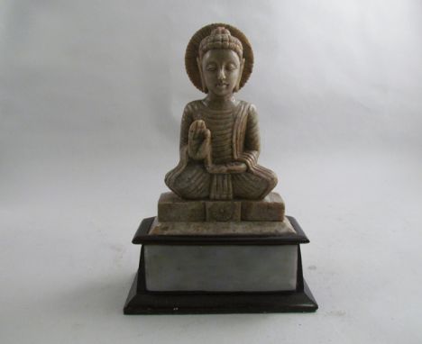 A Japanese hardstone Buddha with jade panel to stand, 23cm tall