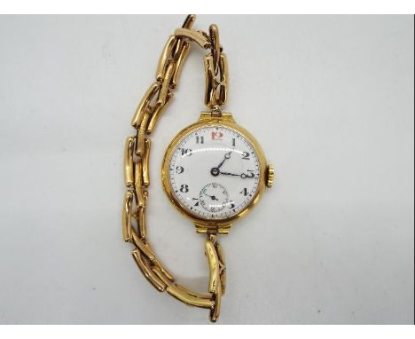 A lady's 15ct gold cased wristwatch on expanding bracelet stamped 15c, Arabic numerals to a white dial, subsidiary seconds di