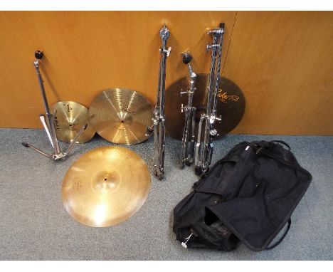 Four cymbals comprising a Magic 12" splash, a Paiste 16" fast crash a Meinl Raker 20" ride and a Sabian 20" ride. [5]