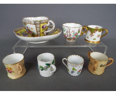 A small collection of miniature ceramics comprising a Royal Worcester / Grainger & Co blush ivory tyg, Royal Worcester loving