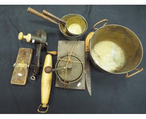 A quantity of vintage kitchenalia to include marmalade cutter, knife cleaner, pans and similar.