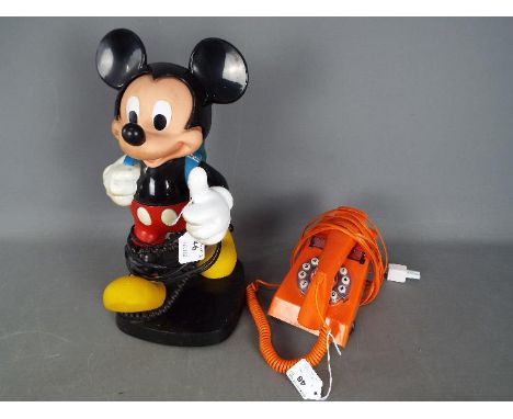 A vintage Tyco Mickey Mouse telephone and a retro orange telephone. [2]