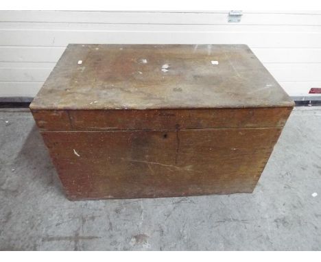 A large wooden trunk or tool chest with hinged lid, approximately 47 cm x 76 cm x 46 cm.