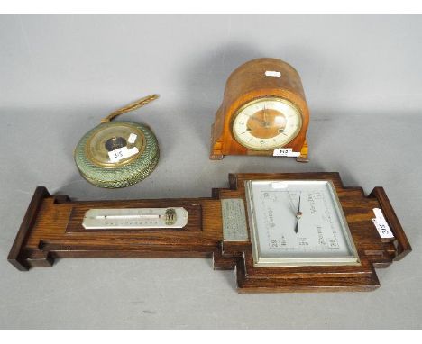 A Smiths mantel clock with key, a wall barometer and one other. [3]