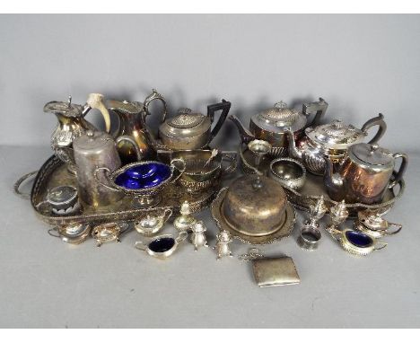 A large quantity of various vintage plated ware comprising trays, cruets, teapots, coffee pots and similar.