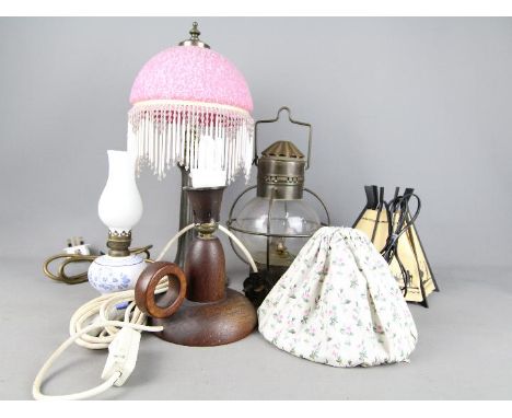 A collection of table lamps, oil lamp, lantern.